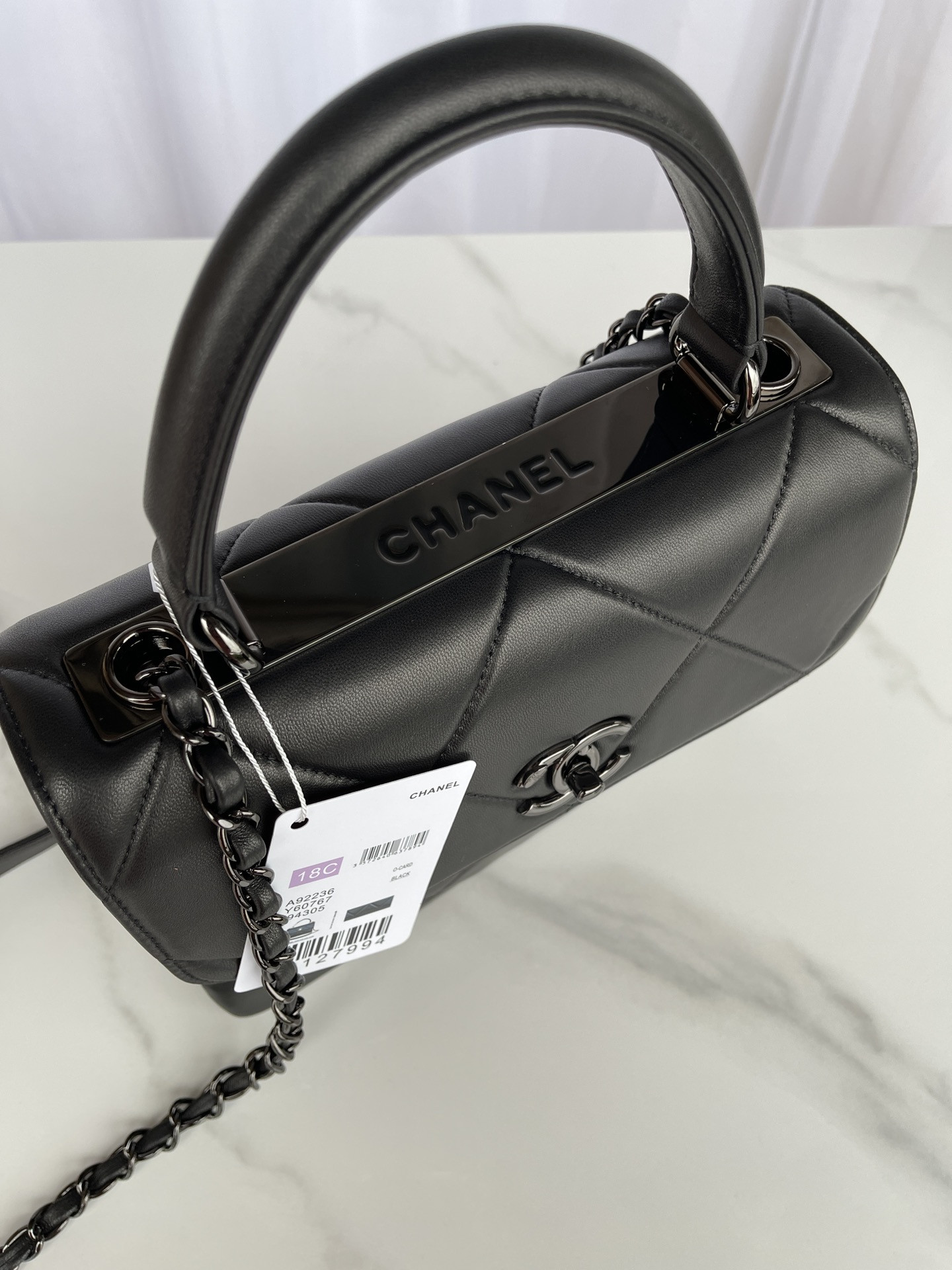 Ch*el flap bag with top handle 6.6 × 9.8 × 4.7 in