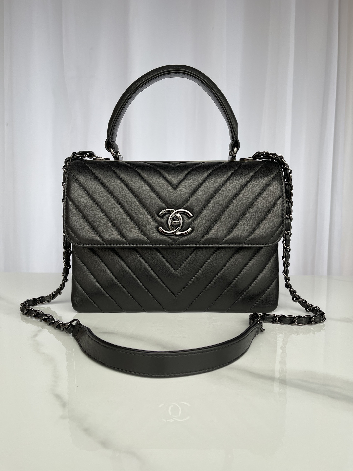 Ch*el flap bag with top handle 6.6 × 9.8 × 4.7 in