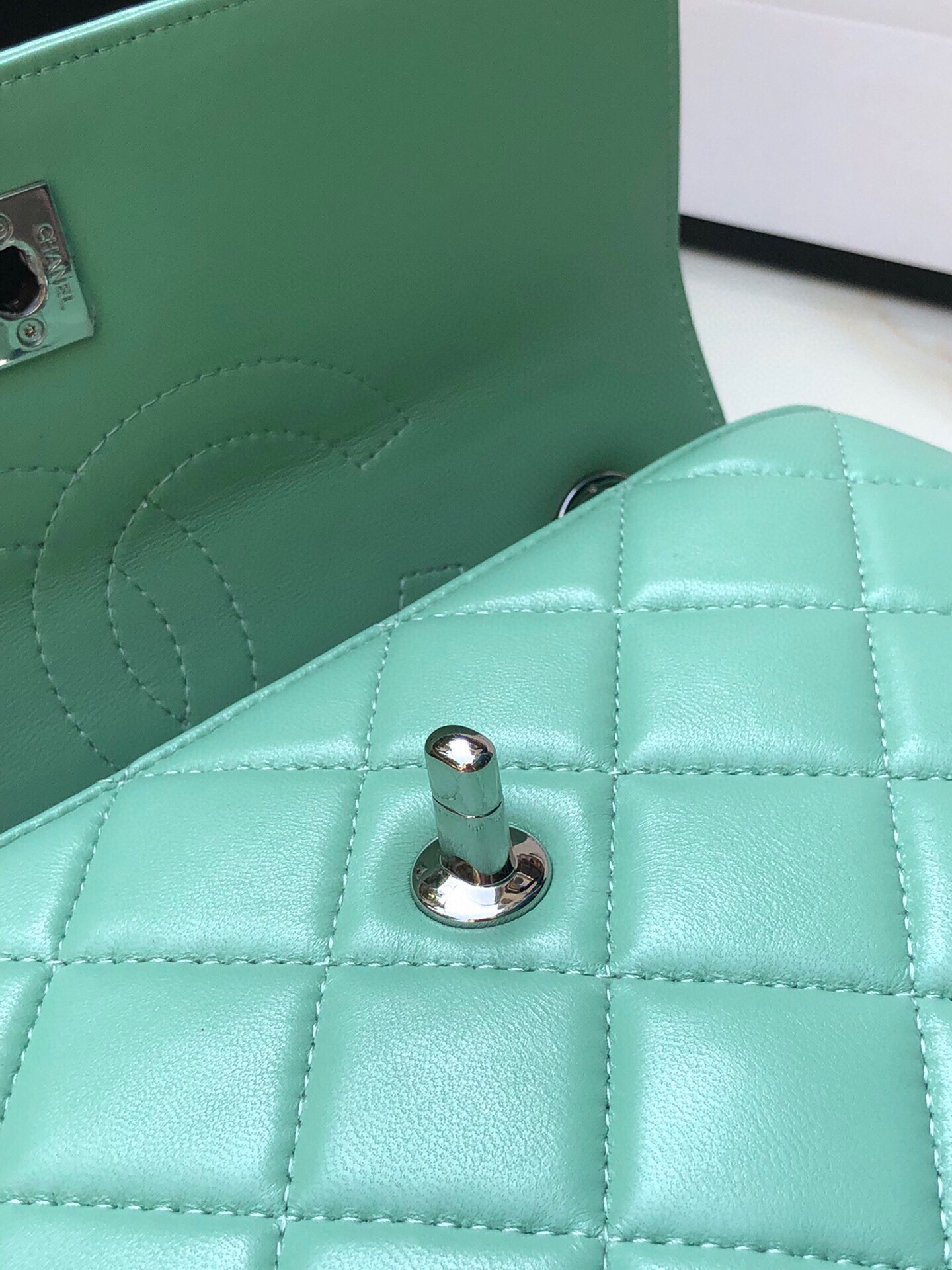 Ch*el flap bag with top handle 6.6 × 9.8 × 4.7 in