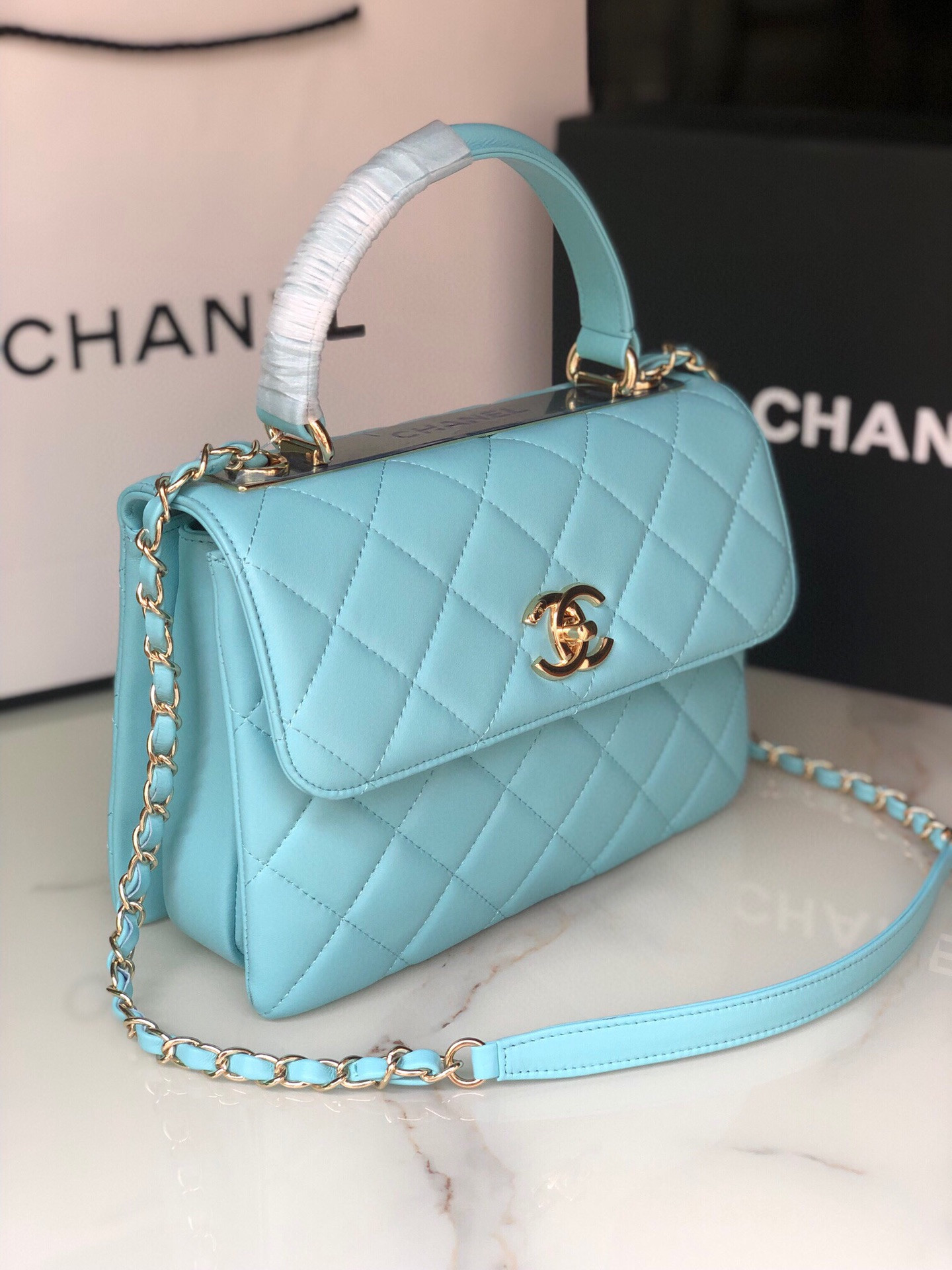 Ch*el flap bag with top handle 6.6 × 9.8 × 4.7 in