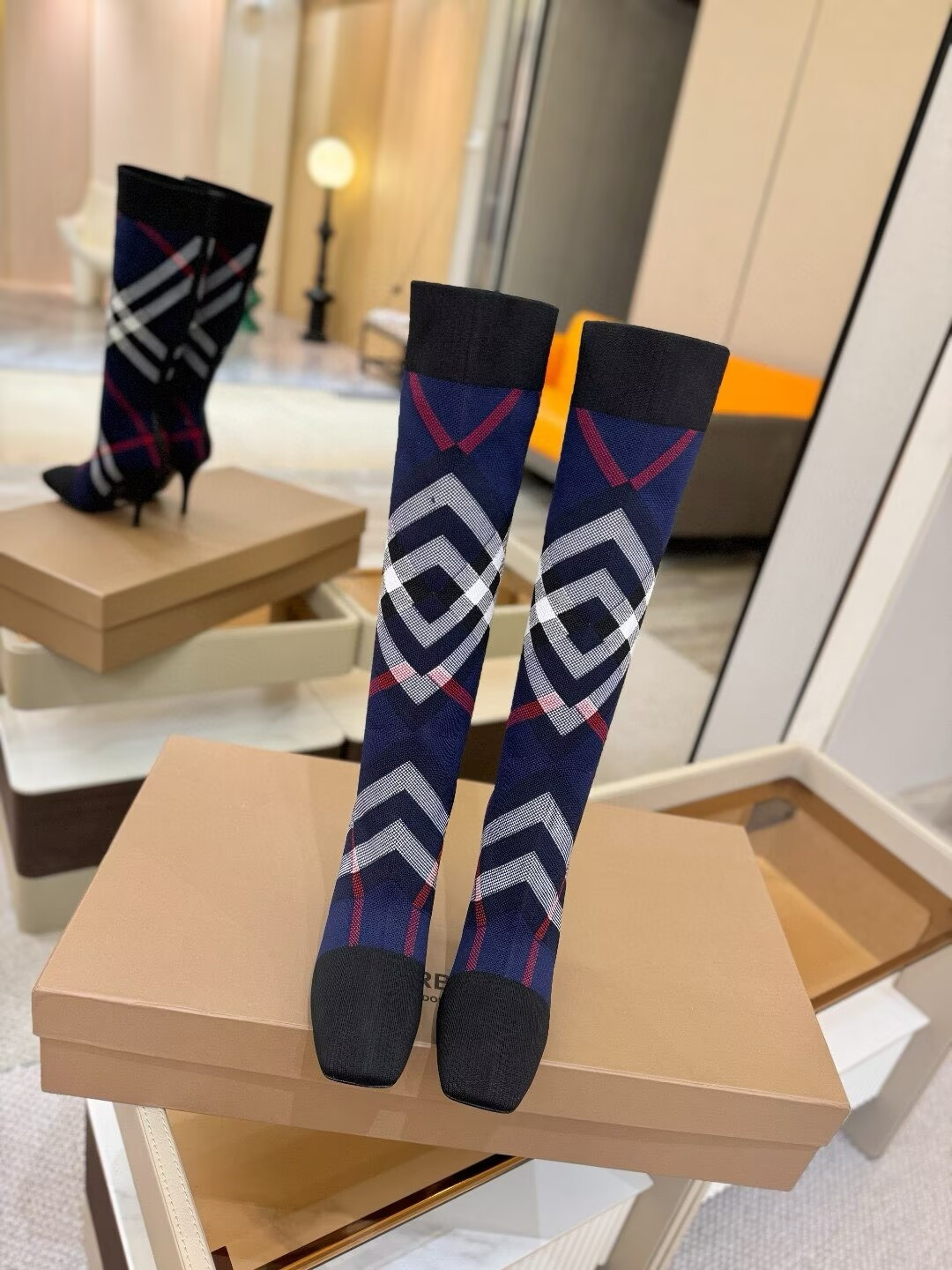 ua Bv*b*rry check high boots
