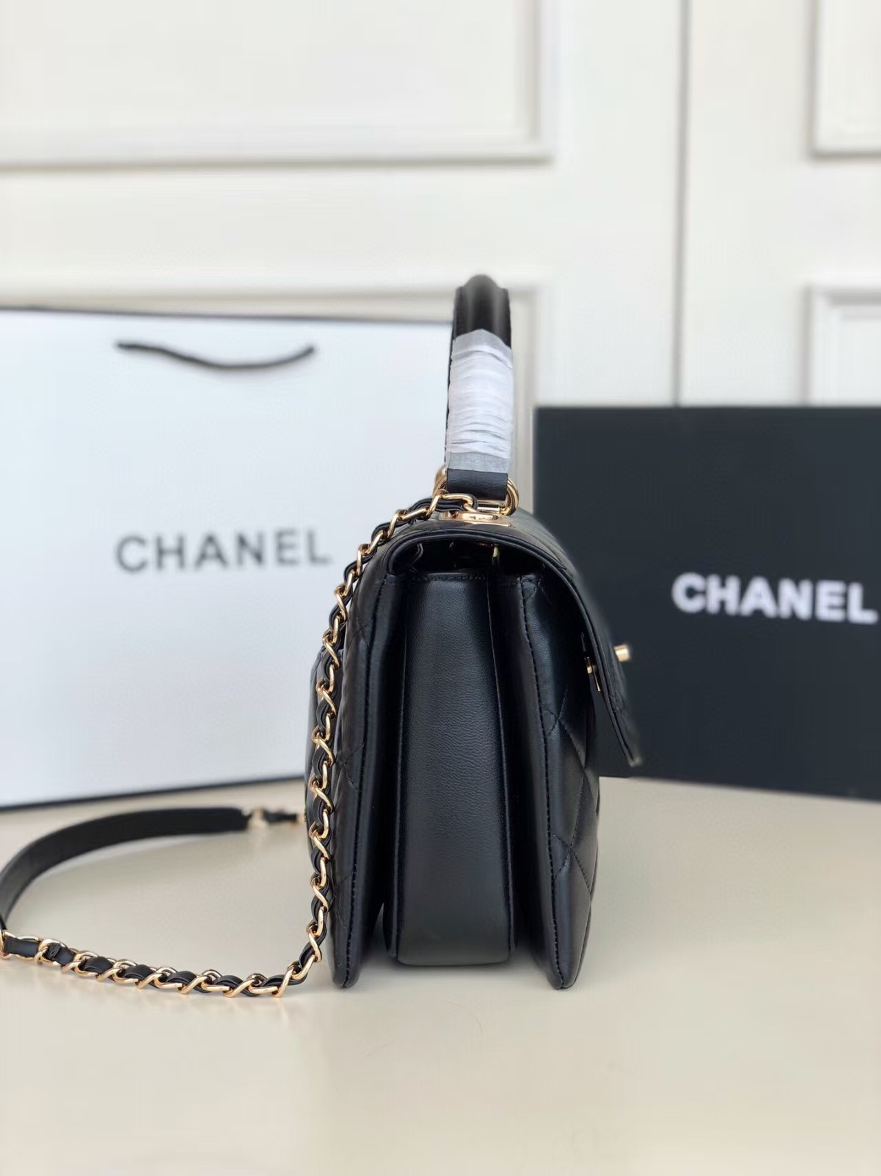 Ch**el flap bag with top handle 6.6 × 9.8 × 4.7 in